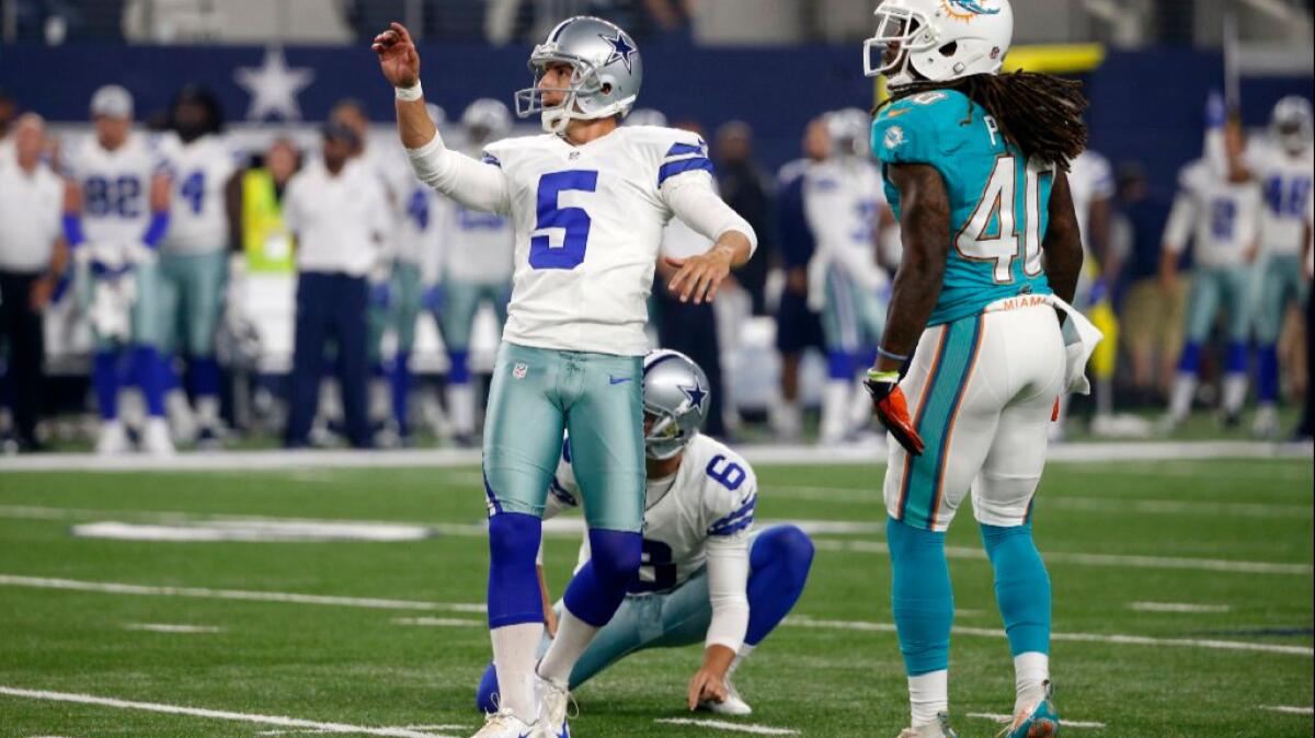 Cowboys kicker Dan Bailey watches the ball after a kick against the Dolphins during an exhibition game on Aug. 19.