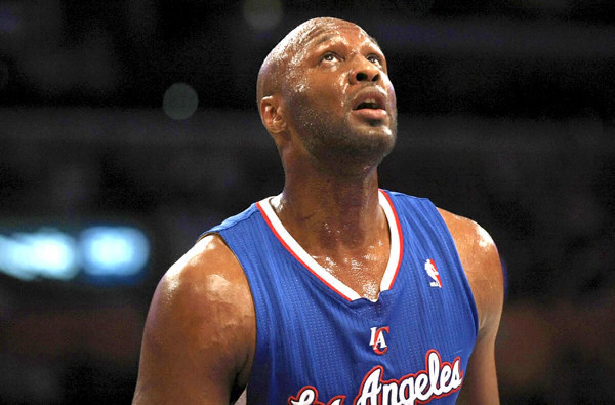 Lamar Odom catches his breath during a Clippers-Lakers game last season.