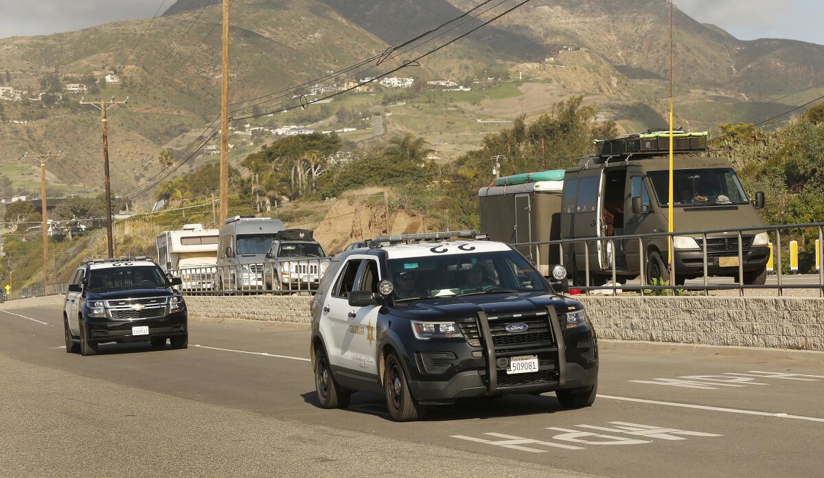 L.A. County sheriff's vehicles during a homeless count in Malibu in 2020. 