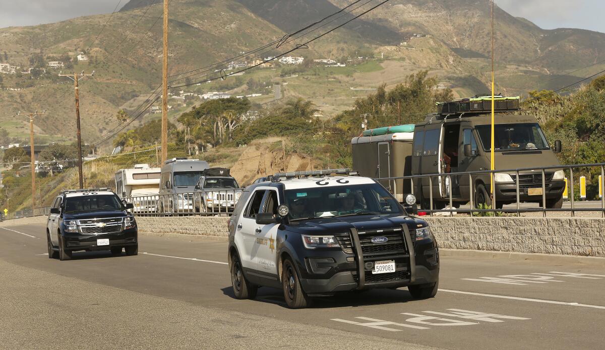 L.A. County sheriff's vehicles during a homeless count in Malibu in 2020.