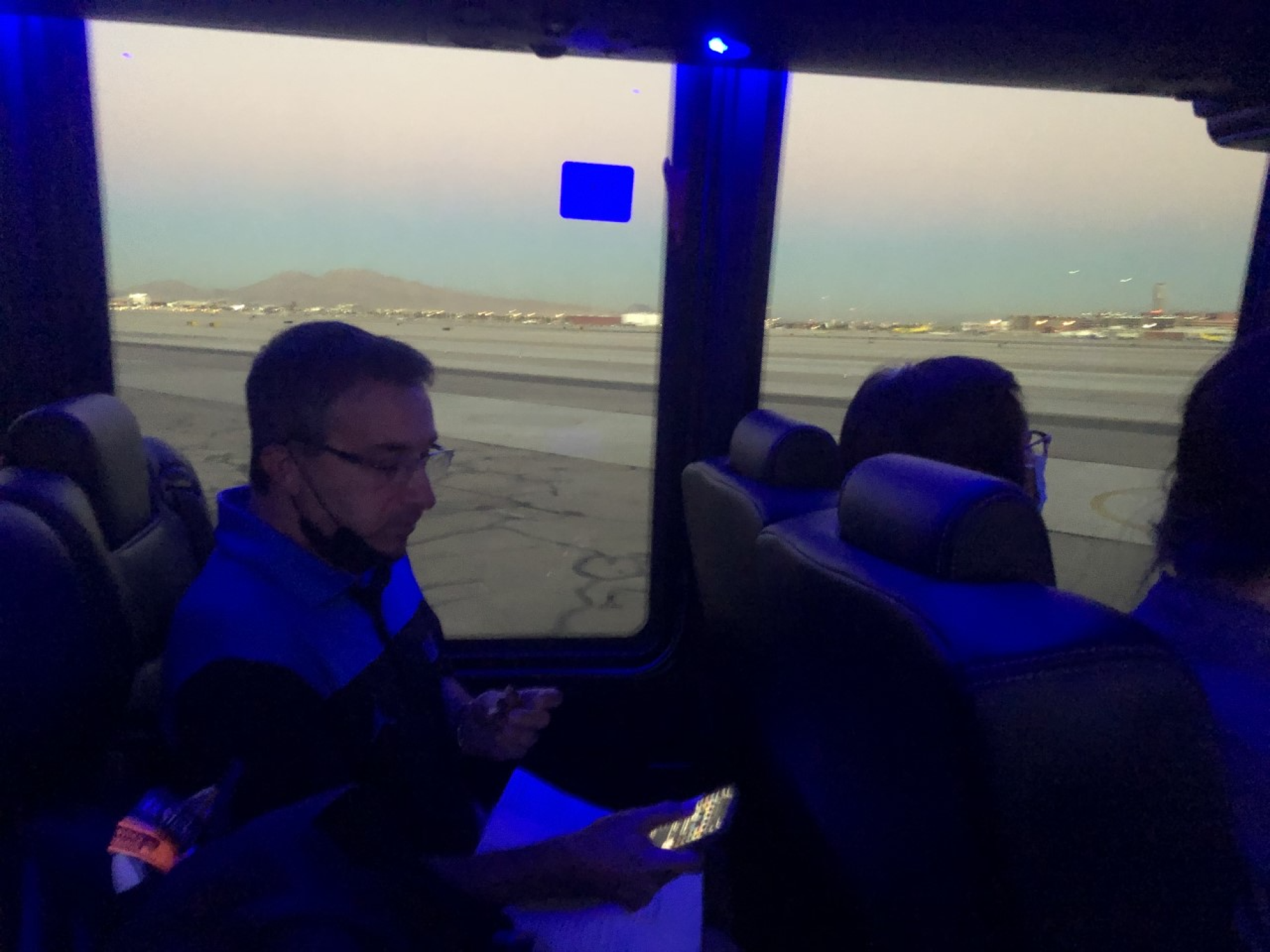Josh Lewin checks his phone at 4:40 p.m. as he rides a shuttle to the plane waiting to take him to Burbank.