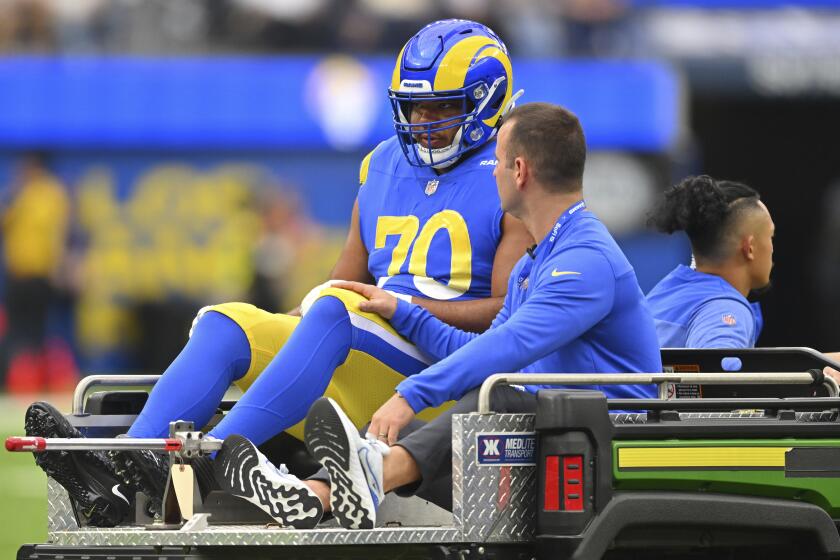 Rams offensive tackle Joe Noteboom is carted off after rupturing his Achilles tendon.