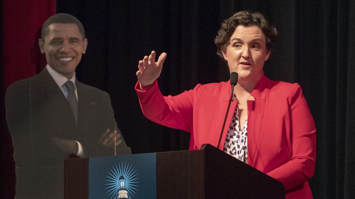 UC Irvine law professor Katie Porter, who is challenging Republican Rep. Mimi Walters in Orange County's 45th Congressional District, speaks to the Laguna Woods Democratic Club.