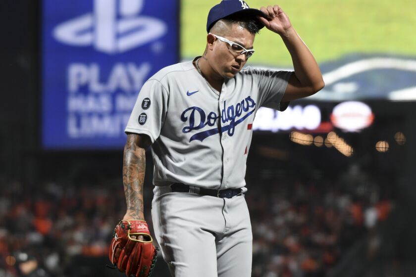 San Francisco, CA - October 09: Los Angeles Dodgers starting pitcher Julio Urias walks off the field during the second inning of game two in the 2021 National League Division Series against the San Francisco Giants at Oracle Park on Saturday, Oct. 9, 2021 in San Francisco, CA. (Wally Skalij / Los Angeles Times)