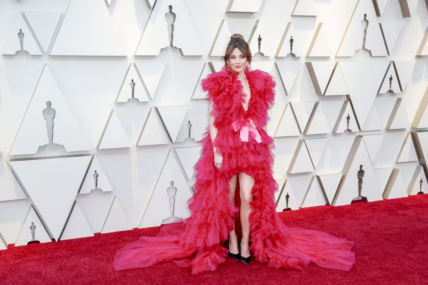 MISS: Linda Cardellini looks like a nightgown nightmare in this ruffled red high-low gown by Schiaparelli.