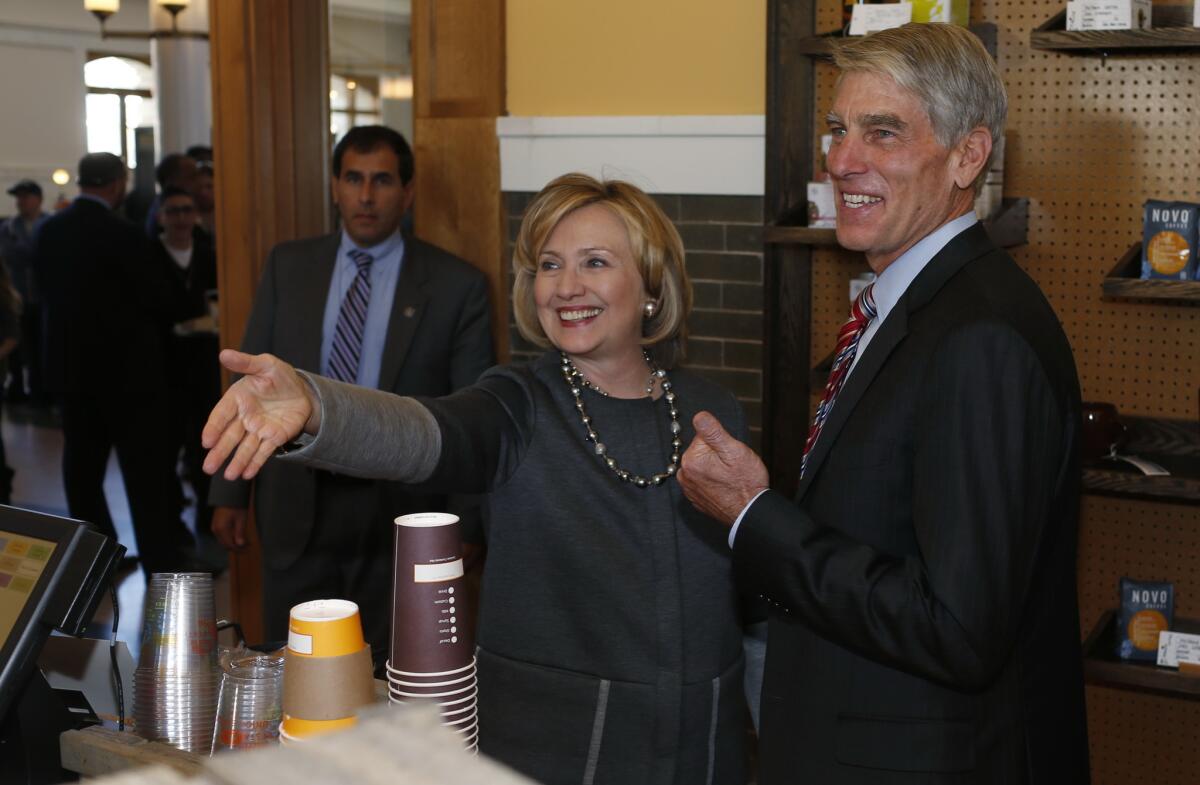 Hillary Rodham Clinton joins U.S. Sen. Mark Udall (D-Colo.) during a campaign stop for him in a coffee shop in Denver's Union Station.