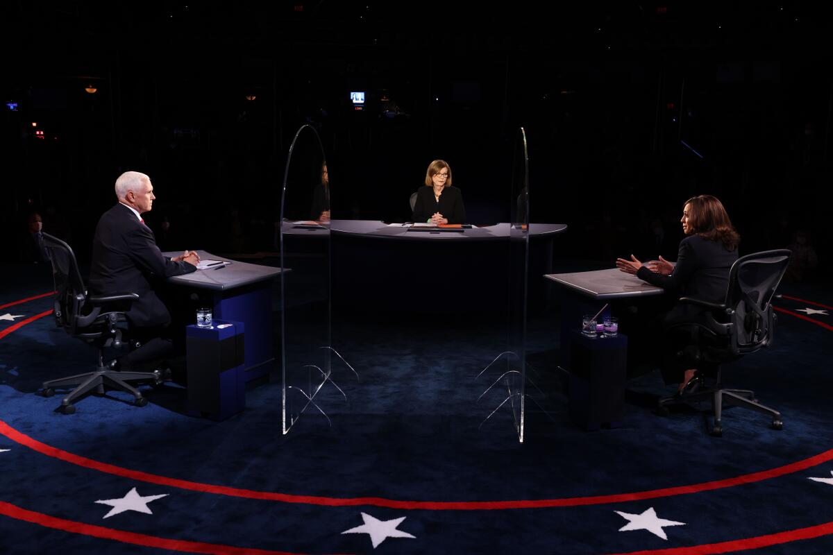  Vice President Mike Penc, Sen. Kamala Harris and moderator Susan Page at the debate.