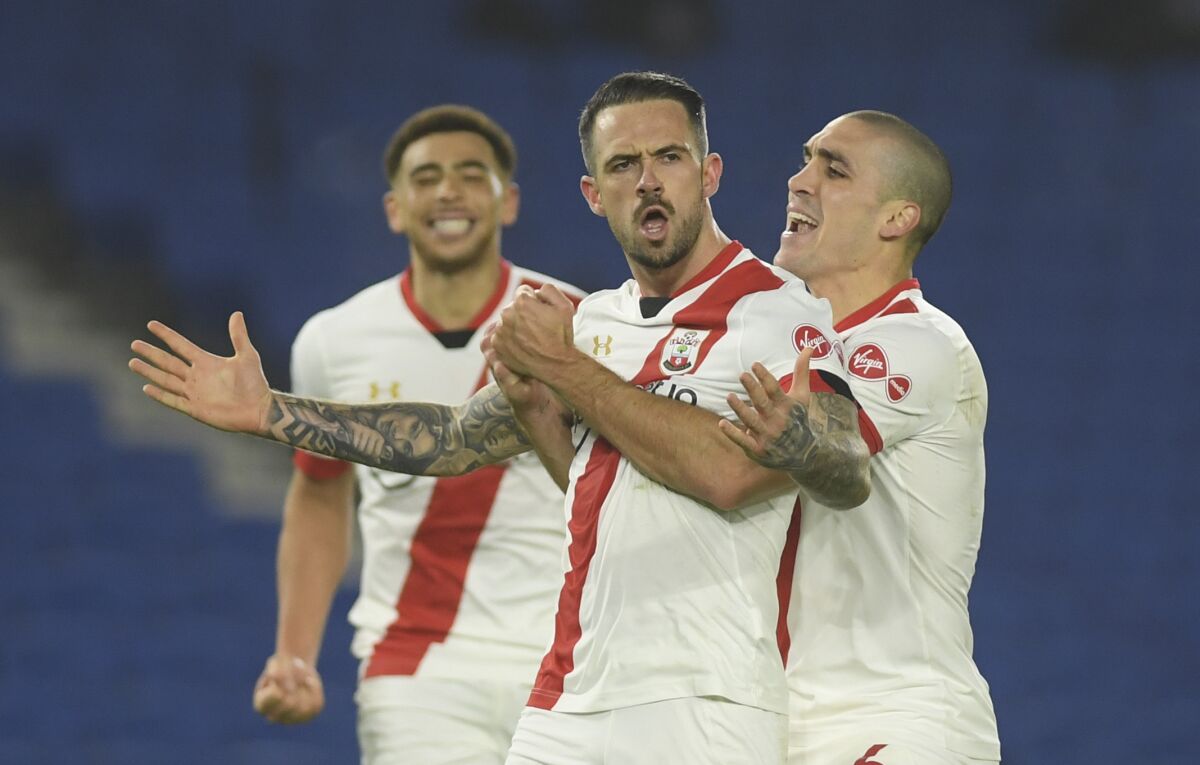 Southampton's Danny Ings celebrates after scoring his side's second goal during the English Premier League soccer match between Brighton and Hove Albion and Southampton in Brighton, England, Monday, Dec. 7, 2020. (Mike Hewitt/Pool Via AP)