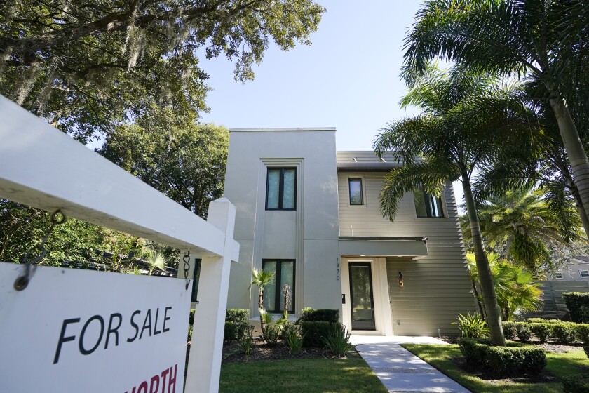 A home for sale is seen Tuesday, Dec. 8, 2020, in Orlando, Fla. U.S. long-term mortgage rates declined this week to new record lows for the first week of 2021. The year opens against the continuing backdrop of damage from the coronavirus pandemic on the U.S. and global economies, which suppressed home loan rates through most of 2020. (AP Photo/John Raoux)