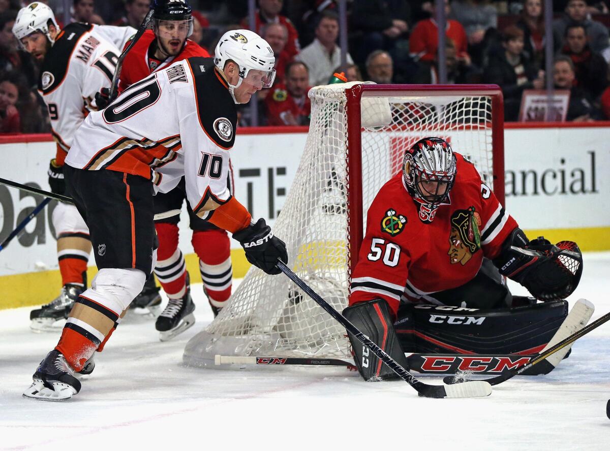 Blackhawks goalie Corey Crawford makes a save against Ducks forward Corey Perry during a game on Feb. 13.