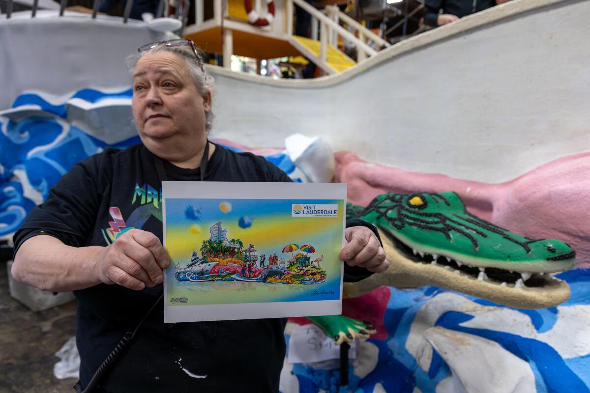Nan Koupal-Smith, float leader, holds a rendering of Lauderdale float for Rose parade "Visit Lauderdale - 