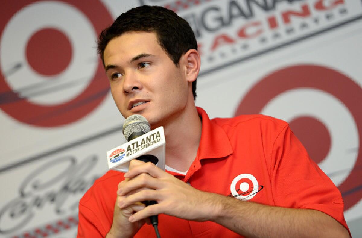 NASCAR driver Kyle Larson addresses the media during a news conference to announce his signing with Chip Ganassi Racing on Friday in Atlanta.