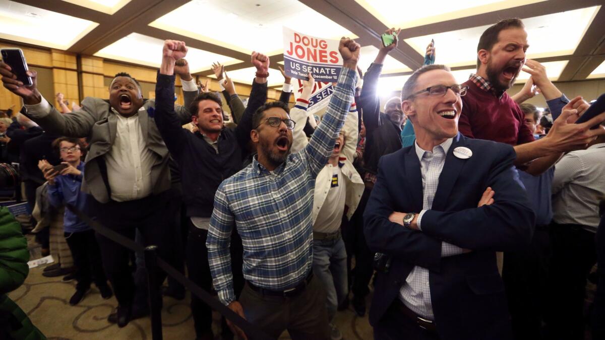 Supporters of Democrat Doug Jones react during an election-night party in Birmingham, Ala., on Dec. 12.