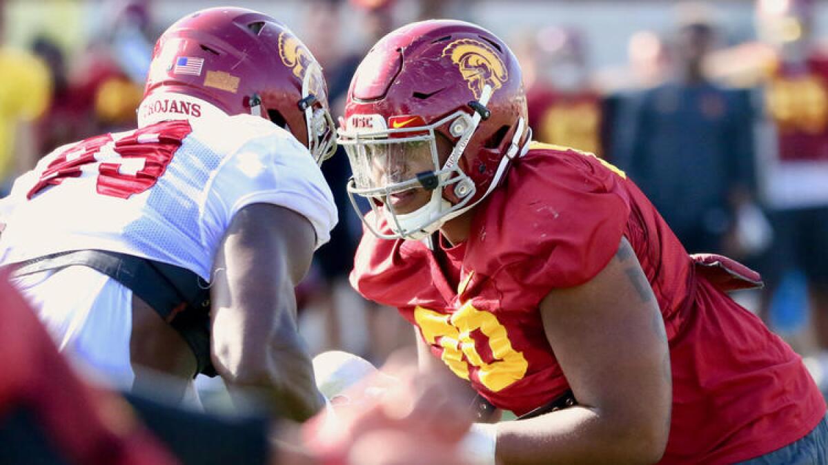 USC's Chuma Edoga (70) squares off against teammate Oluwole Betiku during a spring practice. Edoga is replacing multiyear starter Zach Banner at right tackle.