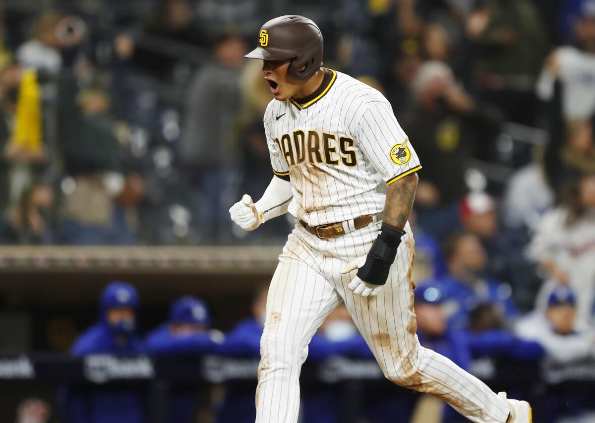 San Diego's Manny Machado celebrates as he scores on a run-scoring single by Eric Hosmer.