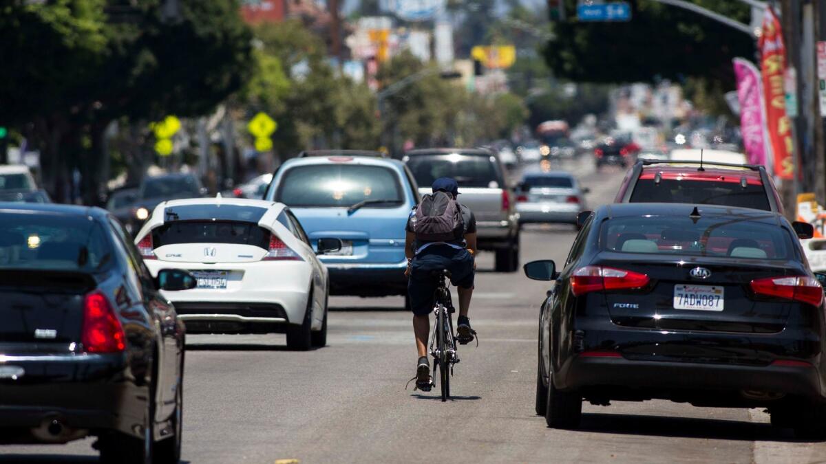 The fight over whether to create bike lanes on Figueroa Street in Highland Park has been a divisive issue in council District 1. (Jabin Botsford / Los Angeles Times)