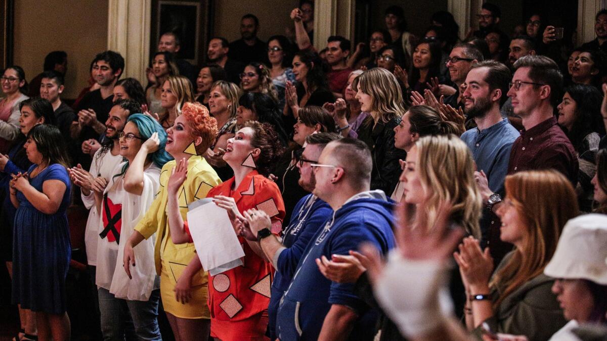 Fans of the show "Crazy Ex-Grilfriend" sing and clap along to the songs performed live by the cast during the performance.