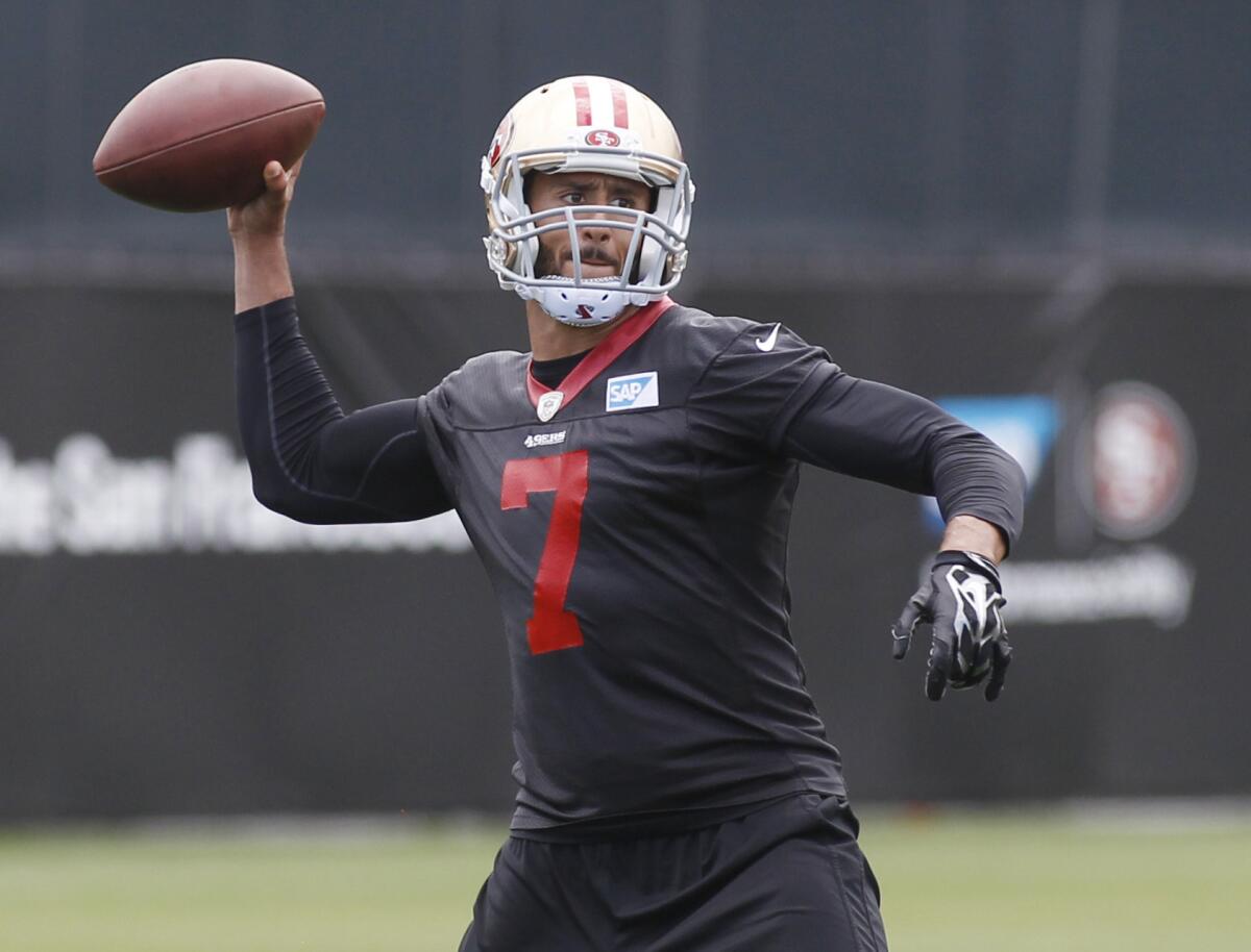 Quarterback Colin Kaepernick practices with the San Francisco 49ers on May 21.