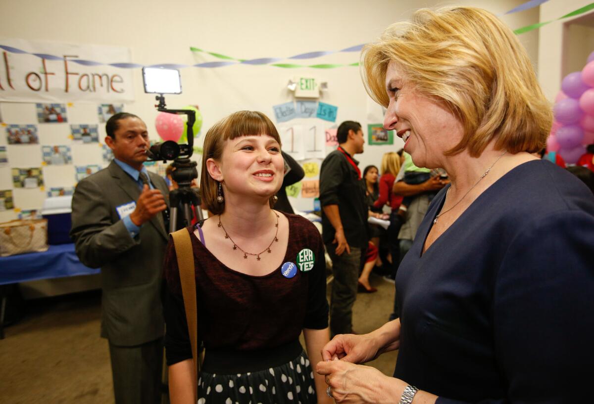 ZOE DONAHOE, 12, chats with City Controller Wendy Greuel at Greuel's campaign headquarters in Boyle Heights. Zoe is working in the office in hopes of helping elect the city's first female mayor.