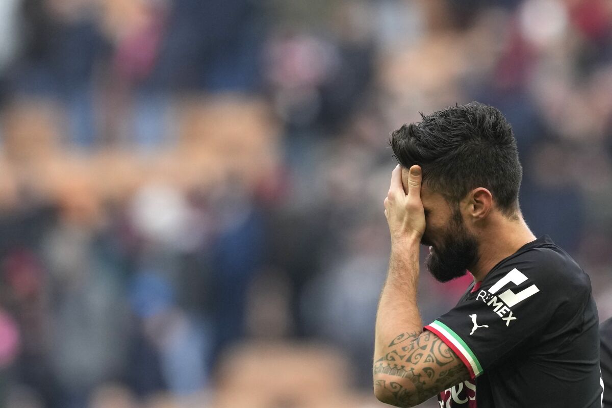 AC Milan's Olivier Giroud reacts after losing a Serie A soccer match between AC Milan and Sassuolo at the San Siro stadium in Milan, Italy, Sunday, Jan. 29, 2023. (AP Photo/Antonio Calanni)