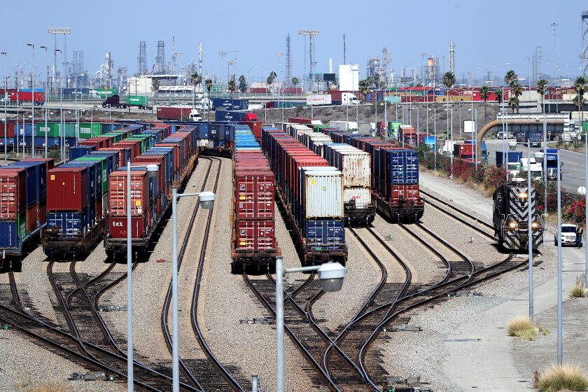 WILMINGTON, CALIF. - SEP. 14, 2022. Containers stacked on rail cars sit in the Port of Los Angeles on Terminal Island. A major railroad strike is looming that could paralyze the nation's supply chain and transportation rail service if both sides don't come to an agreement by the end of the week. A strike could have adverse effects on the prices of many goods, including gasoline. (Luis Sinco / Los Angeles Times)
