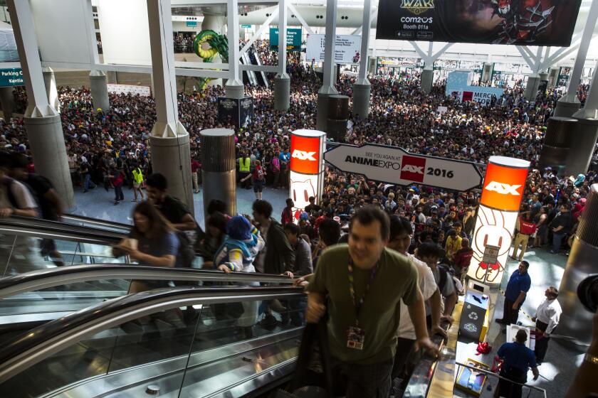 LOS ANGELES, CA. -- THURSDAY, JULY 02, 2015 : People rush up escalators to the exhibition hall right after the opening day of the Anime 2015 Expo at the Los Angeles Convention Center on Thursday, July 02, 2015 in Los Angeles, California. The four-day anime, manga and Japanese pop culture convention that expects over 100,000 attendees continues through Sunday. (Kent Nishimura / Los Angeles Times)