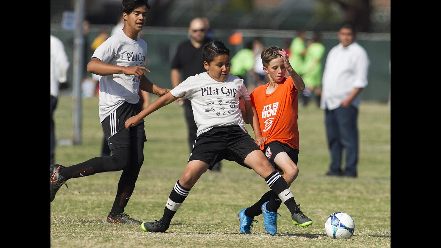 Davis Magnet's Kyle D’alessandro battles for control of a ball with Whittier's Alex Prado during a Daily Pilot Cup boys' 5-6 Gold Division game on Thursday, June 1.