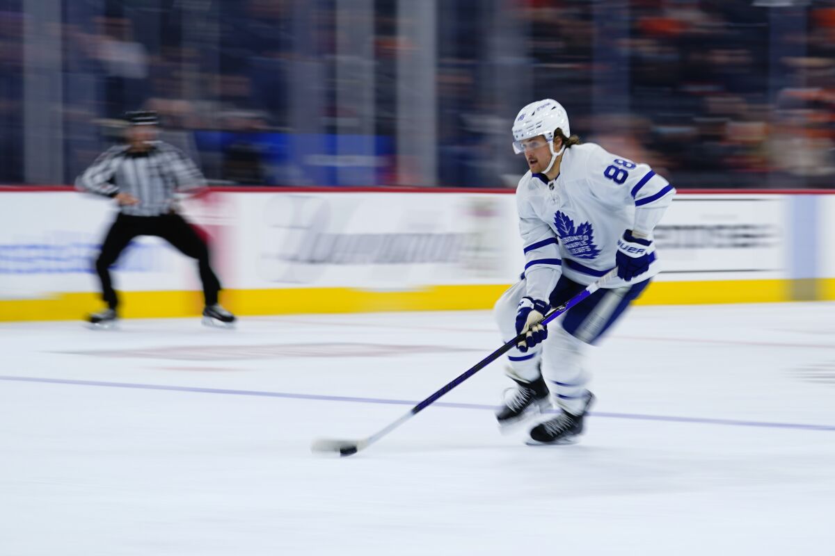Toronto Maple Leafs' William Nylander skates with the puck during the third period of an NHL hockey game against the Philadelphia Flyers, Wednesday, Nov. 10, 2021, in Philadelphia. (AP Photo/Matt Slocum)