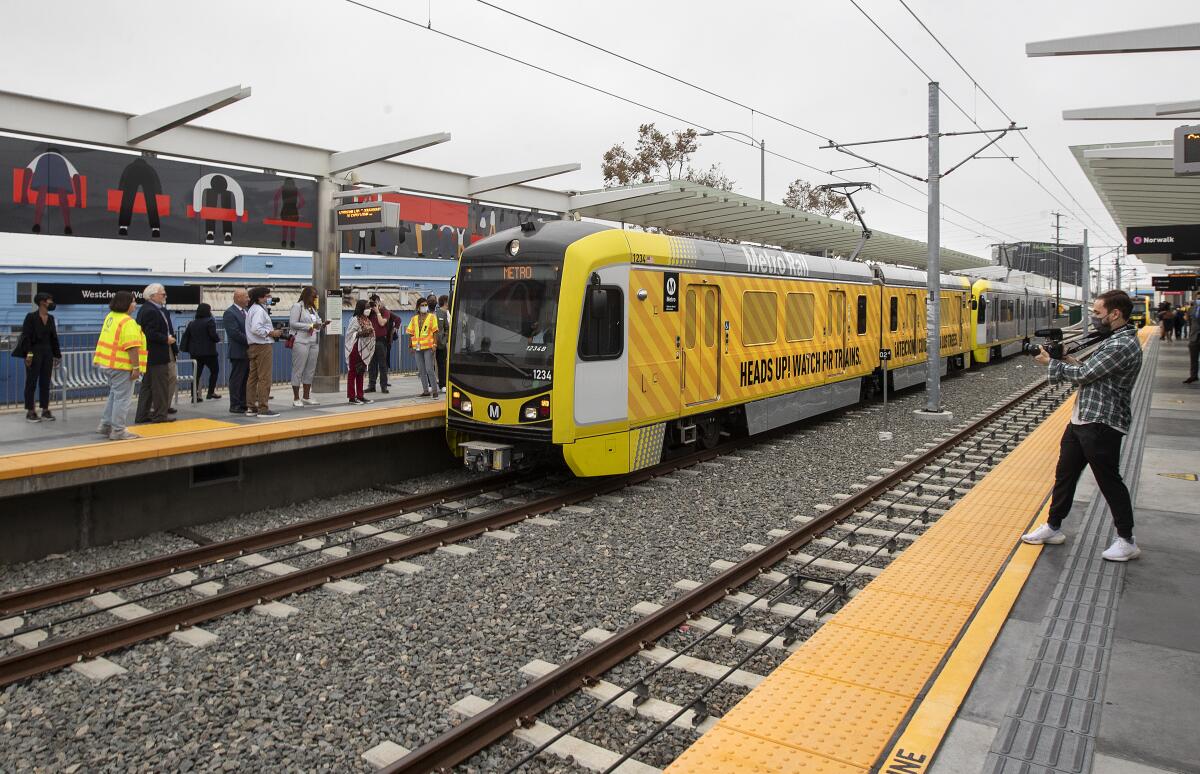 A Metro train arrives at the Westchester/Veterans station in Inglewood.