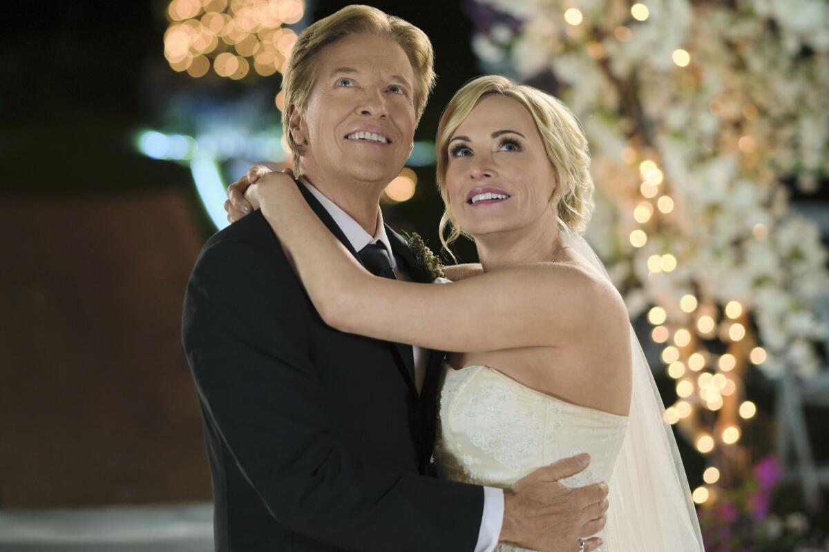 Jack Wagner and Josie Bissett in "Sealed With a Kiss: Wedding March 6" on Hallmark.
