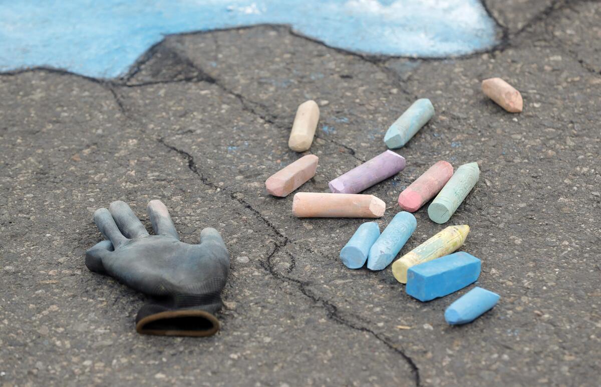 Street artist David Zinn's chalk and glove during a public demonstration on the Promenade on Forest in Laguna Beach.