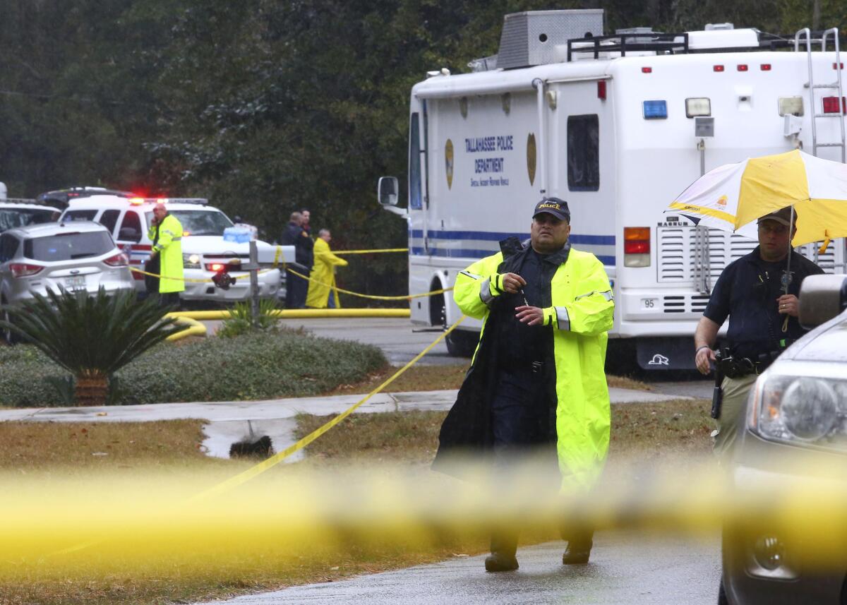 Two members of the Tallahassee Police Department at the scene of Saturday's fatal shooting.