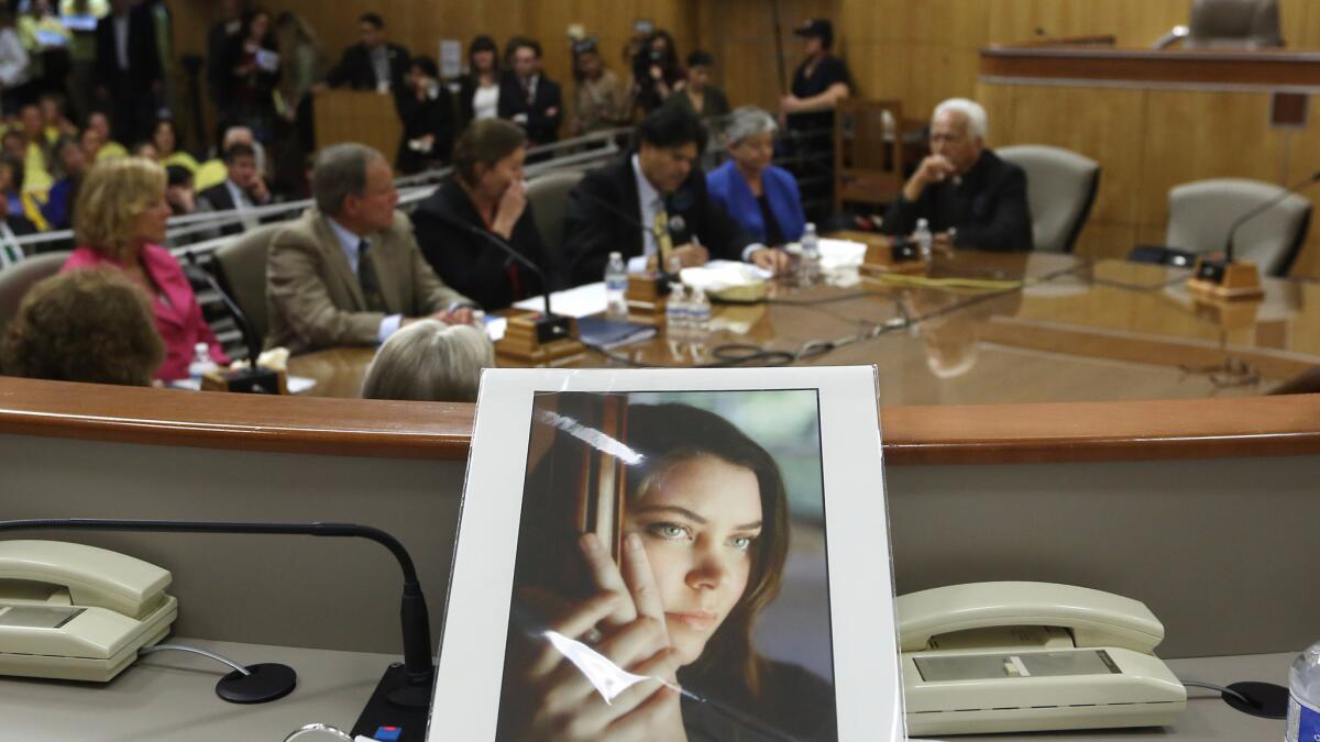 A photo of Brittany Maynard, a Californian dying of cancer who moved to Oregon to end her life in 2014, sits above a state Senate panel hearing on the issue in March of 2015.