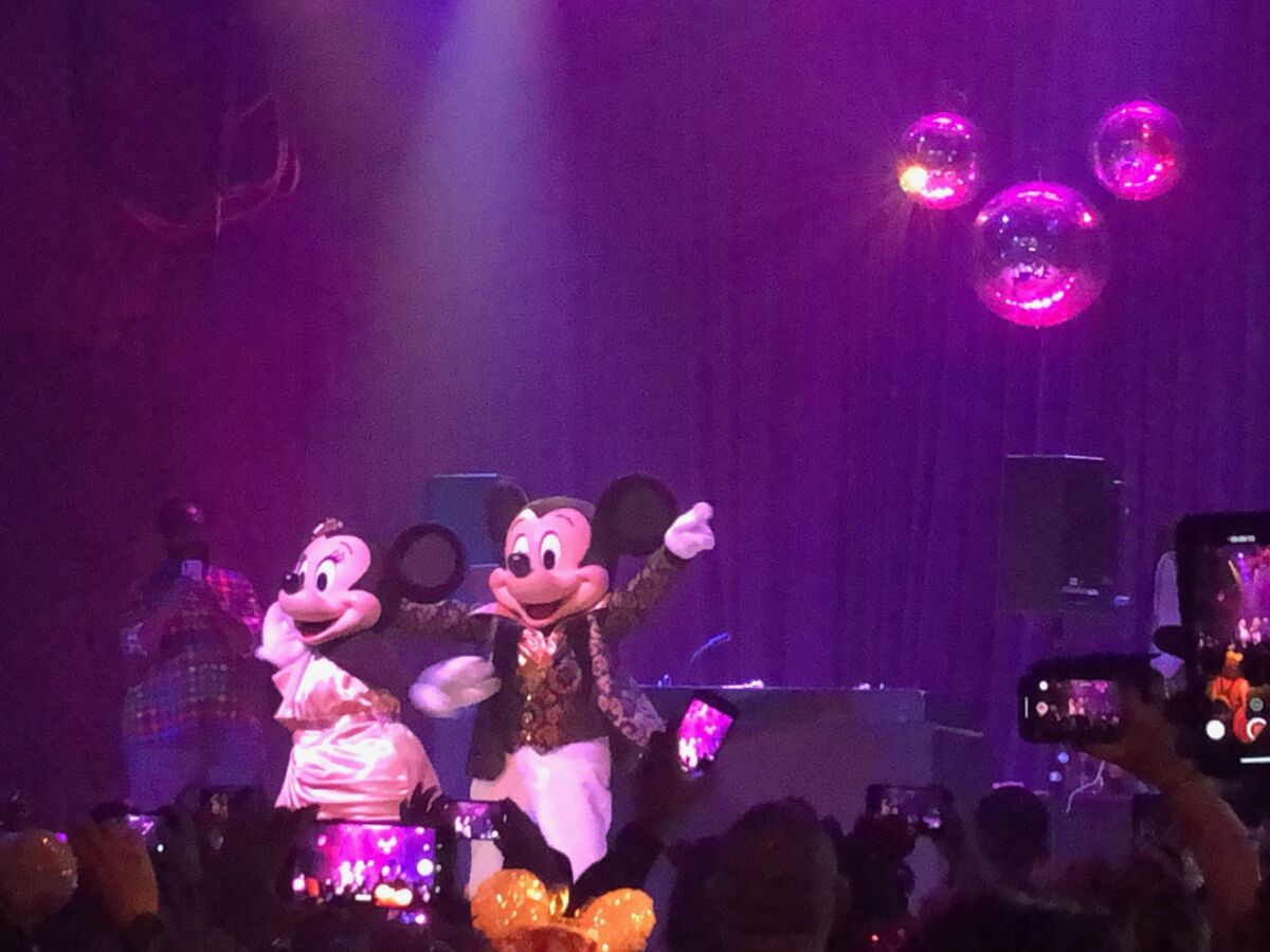 Questlove, back left, watches Minnie and Mickey show off their dance moves.