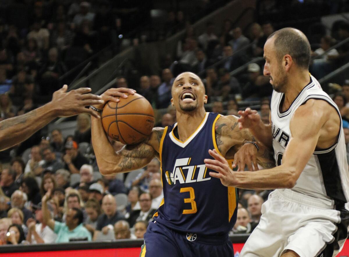 Jazz guard George Hill (3) drives on Spurs veteran Manu Ginobili (20) on Nov. 1.