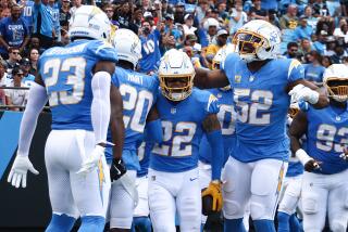 CHARLOTTE, NORTH CAROLINA - SEPTEMBER 15: Elijah Molden #22 of the Los Angeles Chargers celebrates after an interception during the second quarter against the Carolina Panthers at Bank of America Stadium on September 15, 2024 in Charlotte, North Carolina. (Photo by Jared C. Tilton/Getty Images)