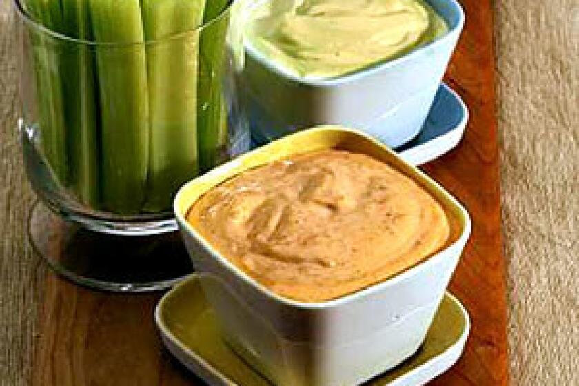 SMOOTH COMBINATIONS: A range of flavors can jazz up classic homemade mayonnaise. Add fresh tarragon and stone-ground mustard, top; sprinkle in a pinch of saffron, middle; or spice things up with a purée of roasted piquillo peppers.