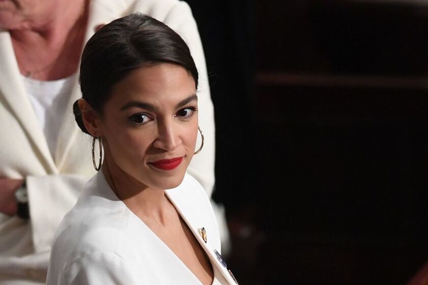 US Representative Alexandria Ocasio-Cortez (D-NY), dressed in white in tribute to the women's suffrage movement, arrives for the State of the Union address at the US Capitol in Washington, DC, on February 5, 2019. (Photo by SAUL LOEB / AFP)SAUL LOEB/AFP/Getty Images ** OUTS - ELSENT, FPG, CM - OUTS * NM, PH, VA if sourced by CT, LA or MoD **