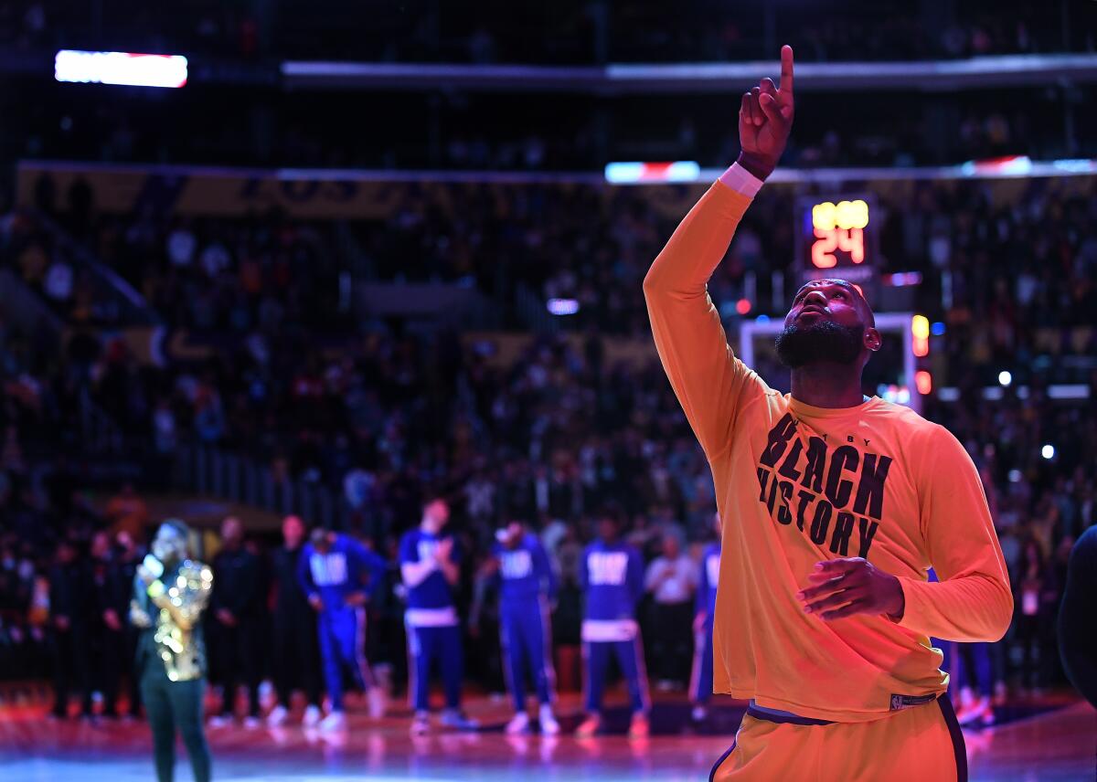 Lakers star LeBron James is photographed at the of the national anthem before a game against the Clippers.