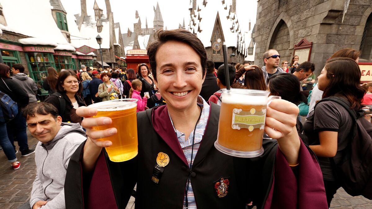 Sereena Worino hoists butterbeer while visiting the Wizarding World of Harry Potter attraction at Universal Studios Hollywood in April.