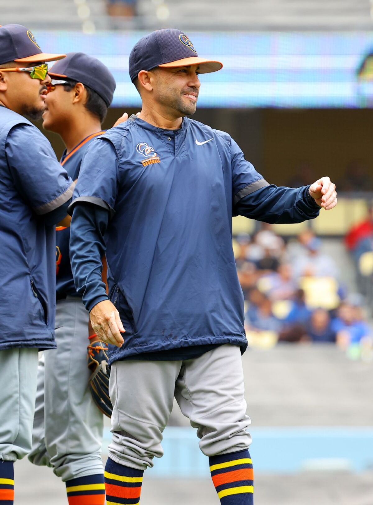Chatsworth coach Marcus Alvarado congratulates players after a victory.