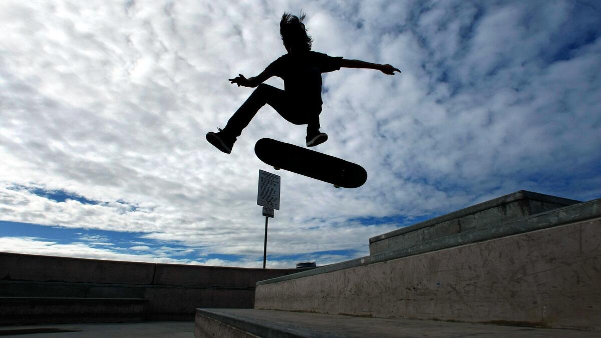A skateboarder performs a trick at the Venice Beach Skate Plaza in Los Angeles.