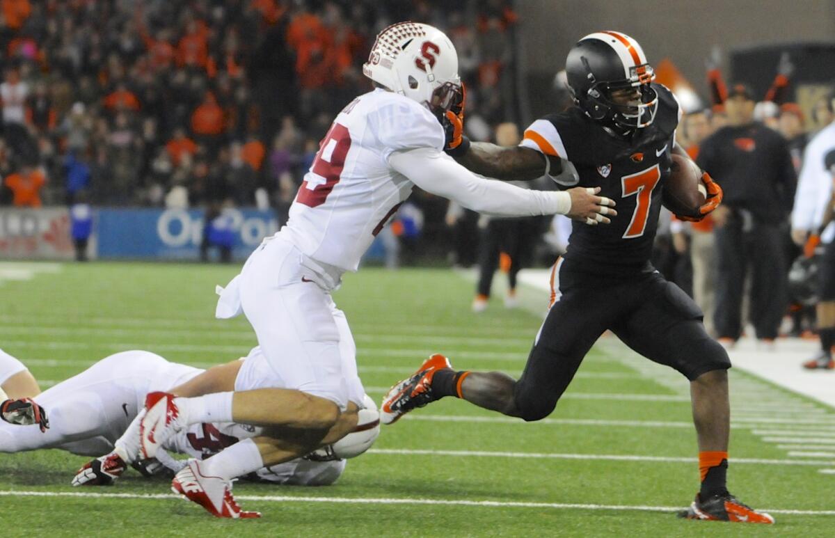 Oregon State's Brandin Cooks, right, tries to sprint past Stanford's Ed Reynolds during last week's loss to the Cardinal. Cooks has 13 touchdown receptions this season.