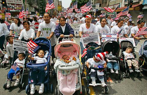 Mothers and their babies marching down Broadway toward City Hall in Los Angeles were among the estimated 25,000 people at a May Day rally for immigration reform. The number of participants was considerably smaller than last year's event, but the enthusiasm endured. A second march to MacArthur Park drew about 10,000 participants