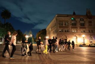 LOS ANGELES, CALIFORNIA - APRIL 24: Protestors are detained by LAPD officers who were trying to clear the USC campus during a demonstration against the war in in Gaza Wednesday. (Wally Skalij/Los Angeles Times)