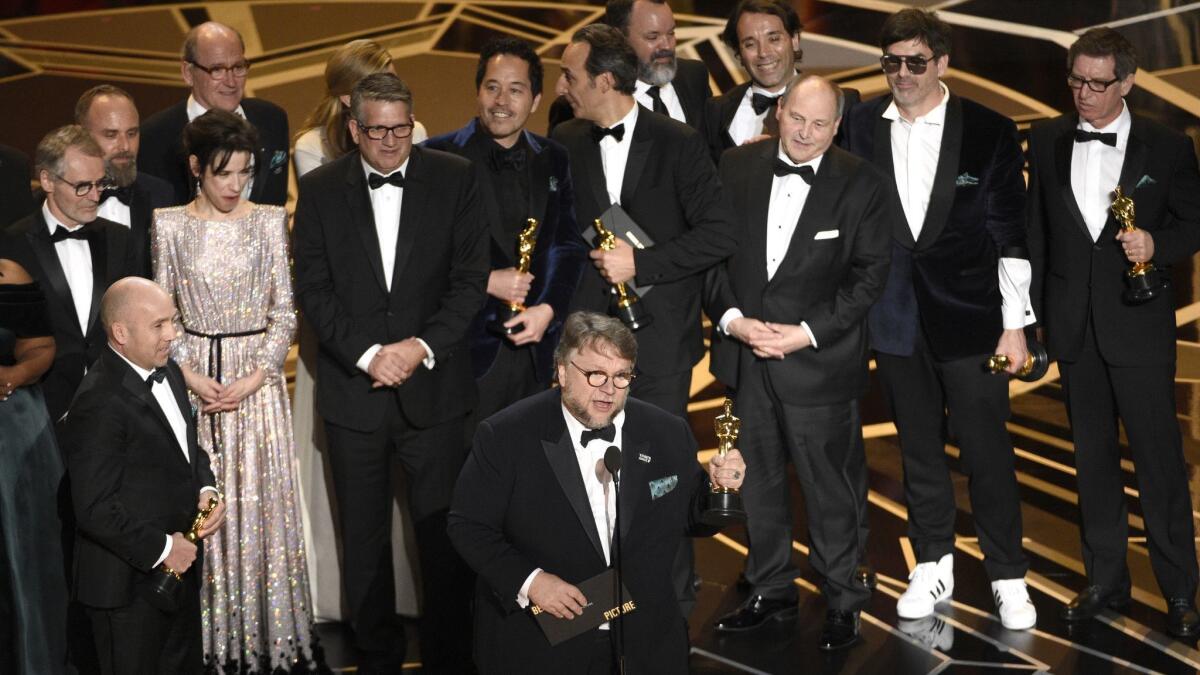 Director Guillermo del Toro and the cast and crew of "The Shape of Water" accept the Oscar for best picture at the Dolby Theatre in Los Angeles.