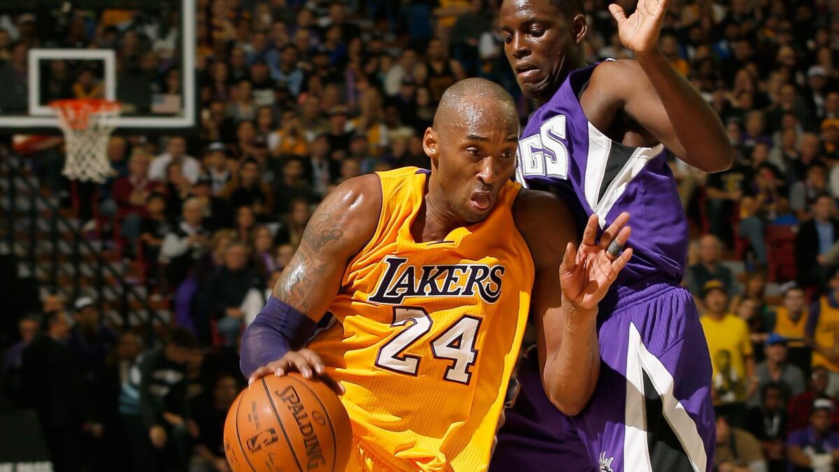 Lakers guard Kobe Bryant drives past Kings guard Darren Collison during their game Thursday night in Sacramento.