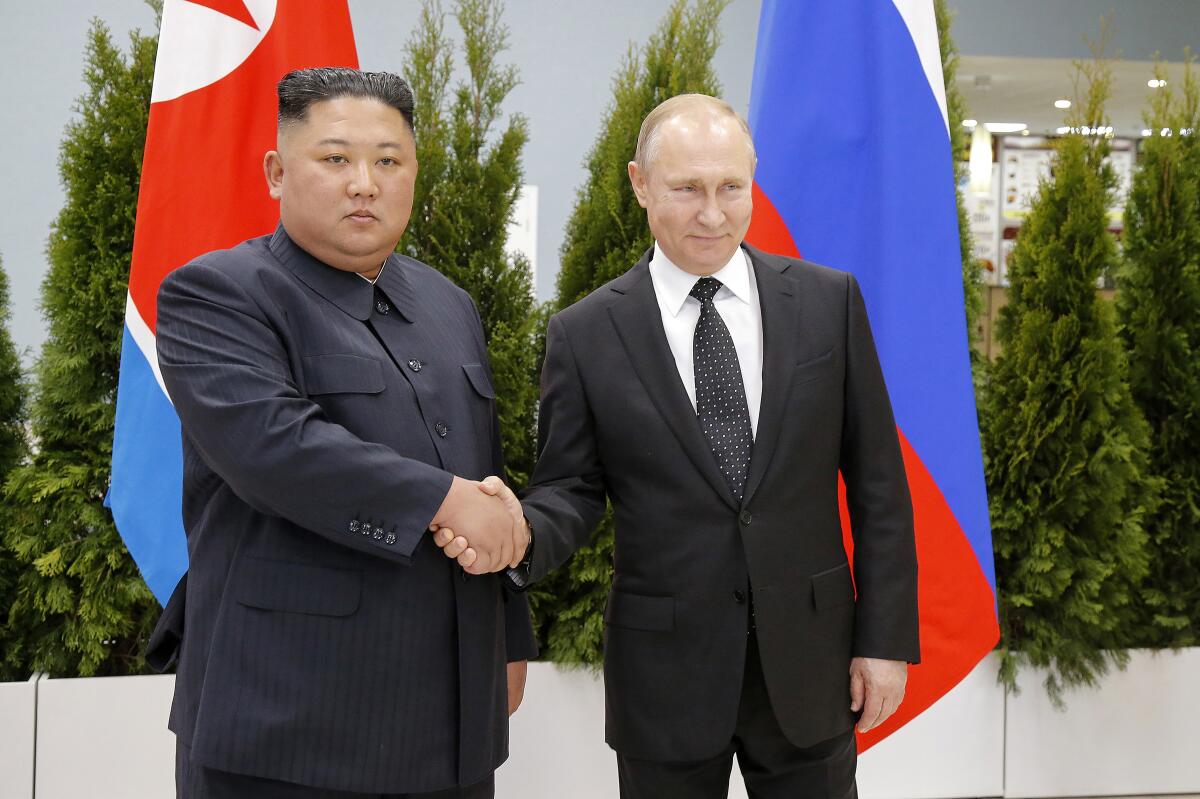 North Korean leader Kim Jong Un and Russian President Vladimir Putin shaking hands