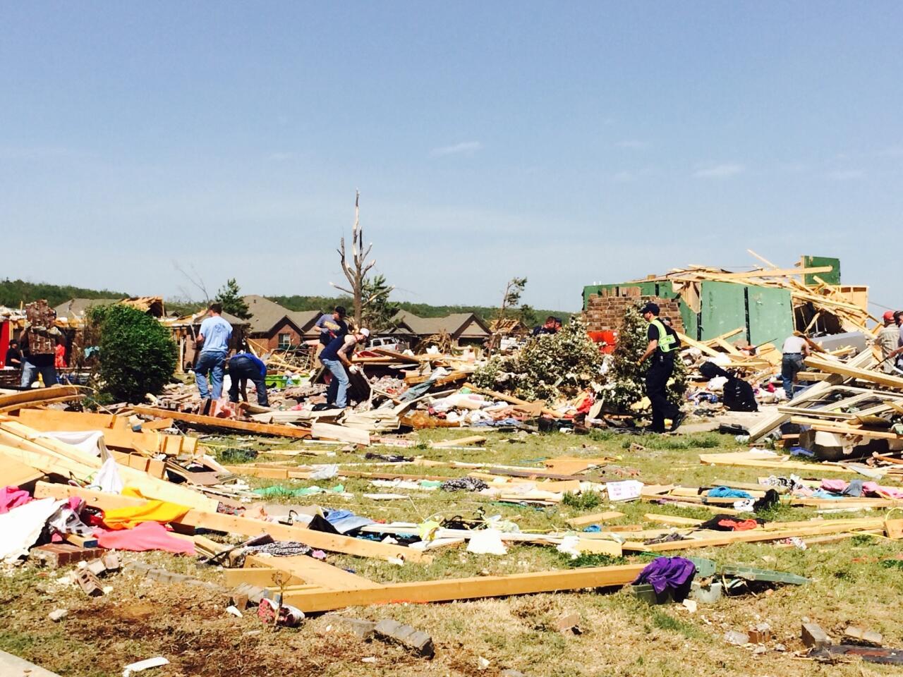 Residents pick through debris Monday in tornado-hit Vilonia, Ark.