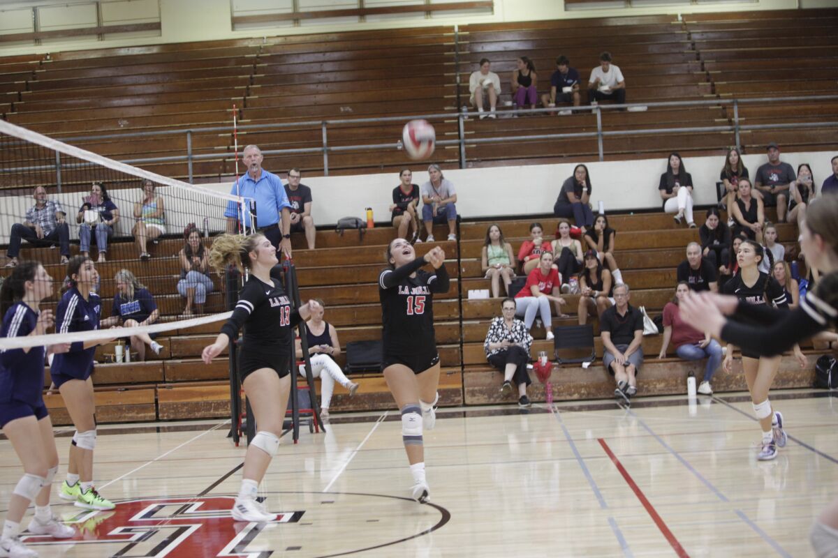 La Jolla's Lindsay Laumann (15) and Annabelle Brown (13) chase down the ball.